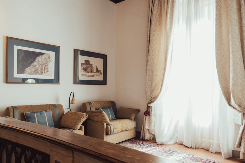 Junior Suite | Living area | 27-inch flat-screen TV with digital channels, TV