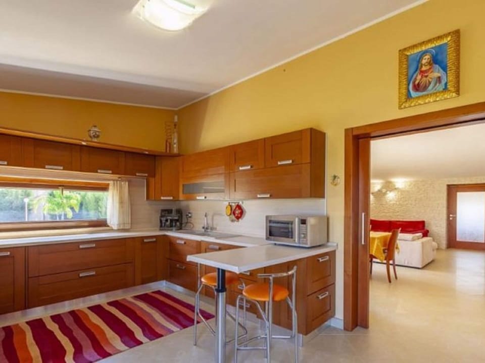 Villa | Private kitchen | Electric kettle, highchair