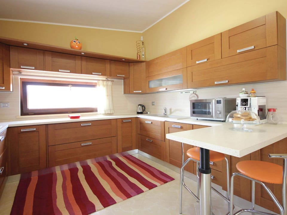 Villa | Private kitchen | Electric kettle, highchair