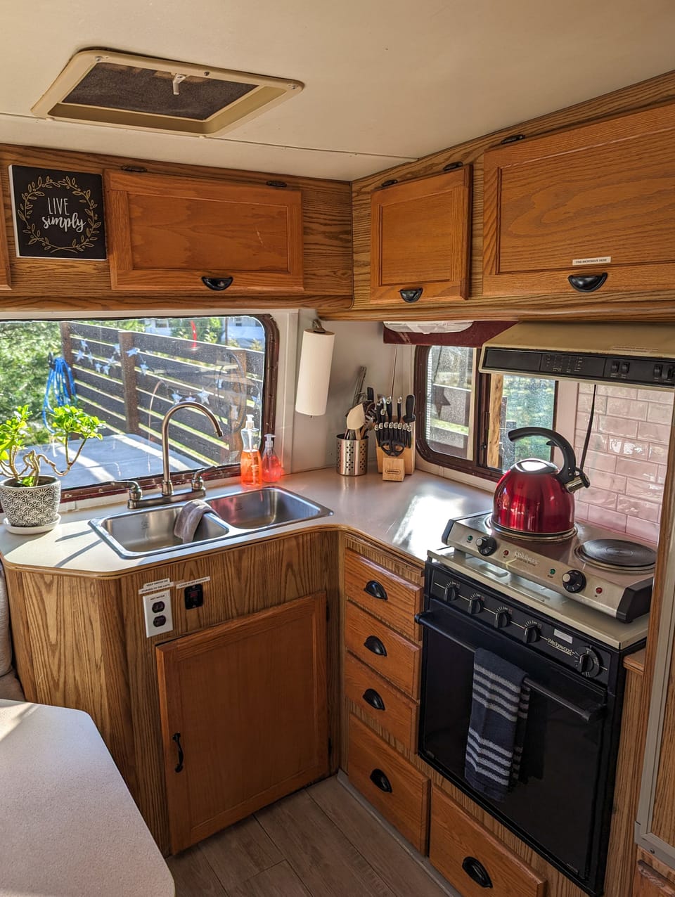 Kitchen is equipped with a 2 burner electric hot plate, microwave, and toaster. 