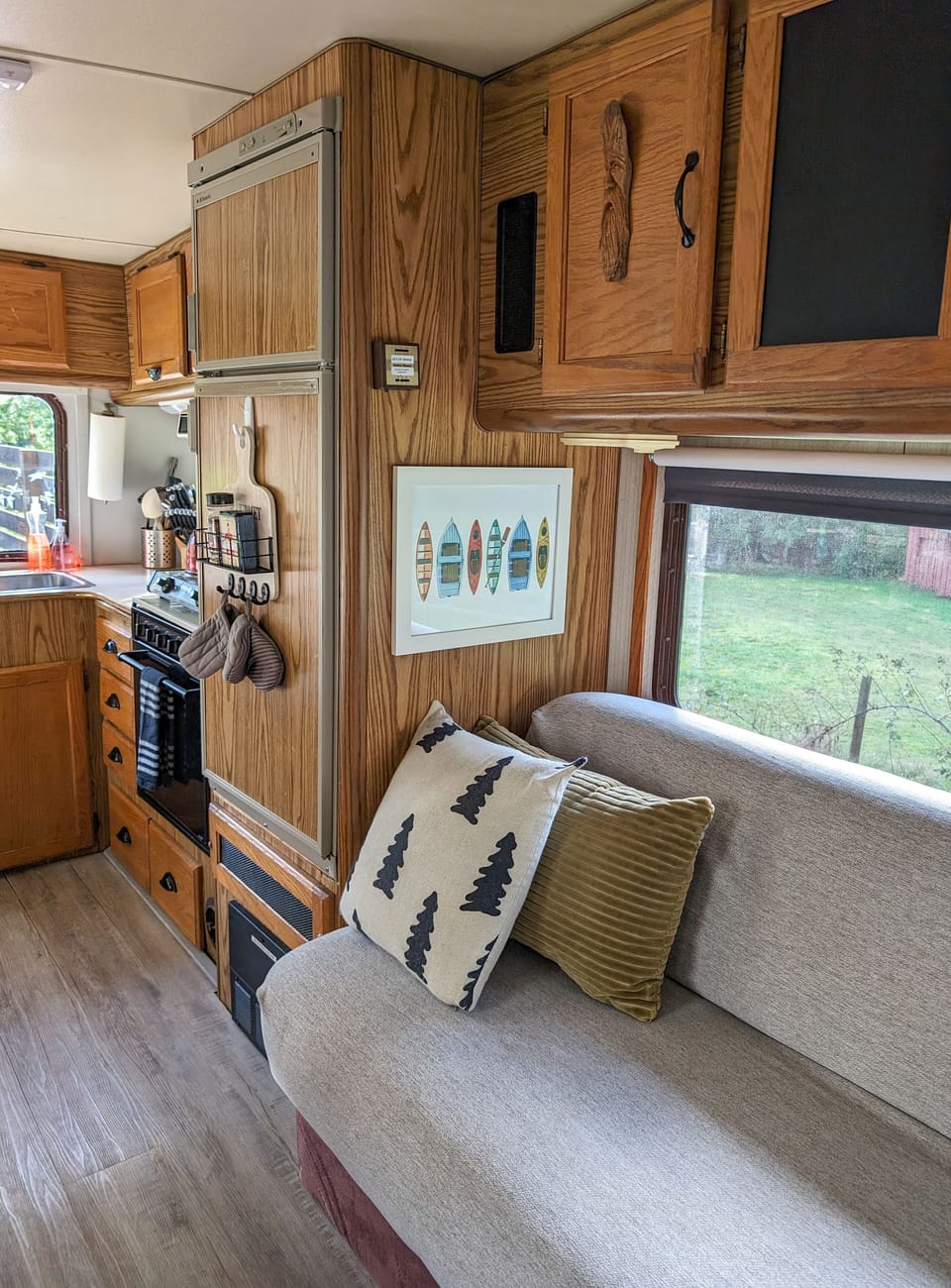 Bedding for pullout couch is kept in the cupboards above.