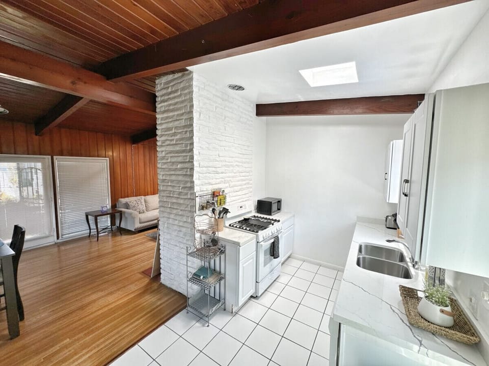Fully equipped kitchen with pots, pans, plates, cups, etc.