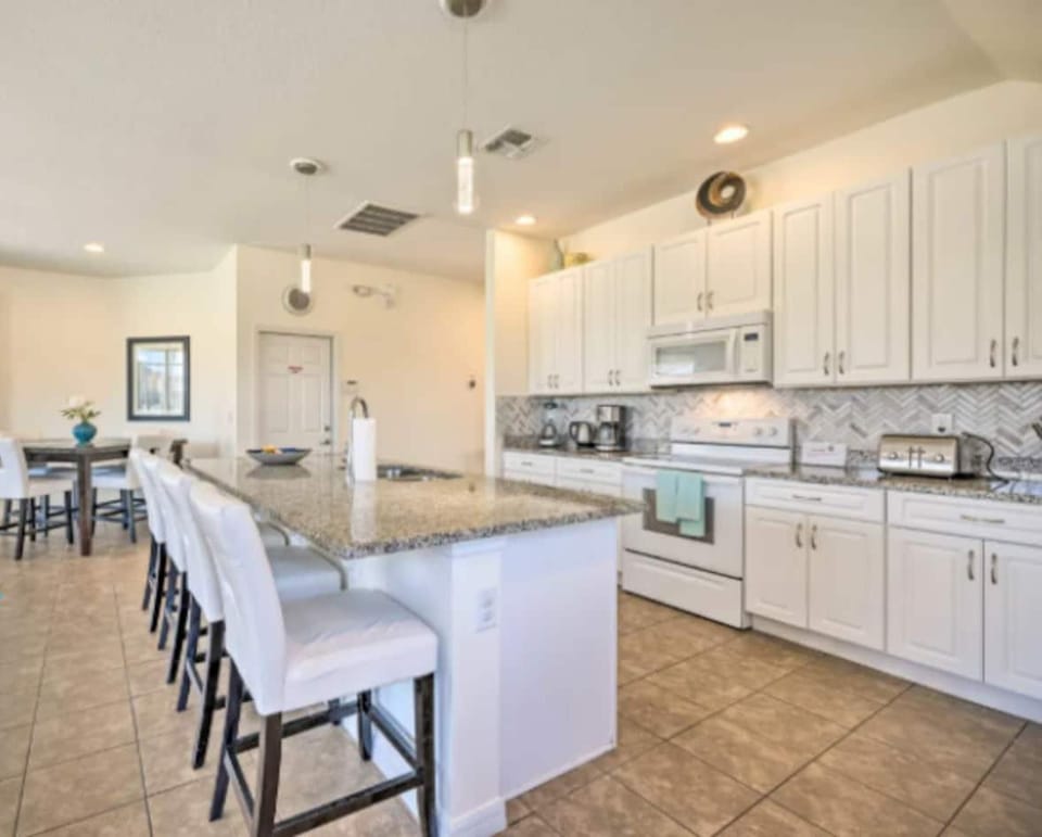 The layout of this house is ideal for 2 families traveling together.  The main floor is open concept with a modern kitchen with large island overlooking comfortable family gathering area.  Gather with family & friends in the bright and airy great roo