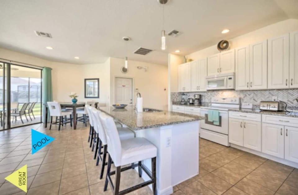 The layout of this house is ideal for 2 families traveling together.  The main floor is open concept with a modern kitchen with large island overlooking comfortable family gathering area.  Gather with family & friends in the bright and airy great roo