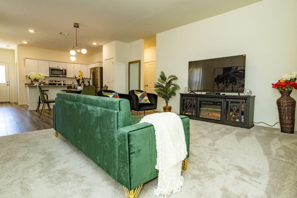 Well furnished living room; electric fireplace and several entertainment options