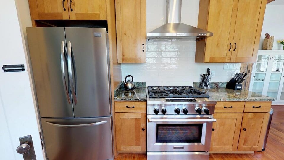 Kitchen with gas stove and oven, all cooking utensils included