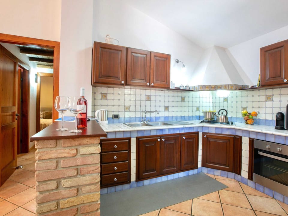 Villa | Private kitchen | Electric kettle, highchair