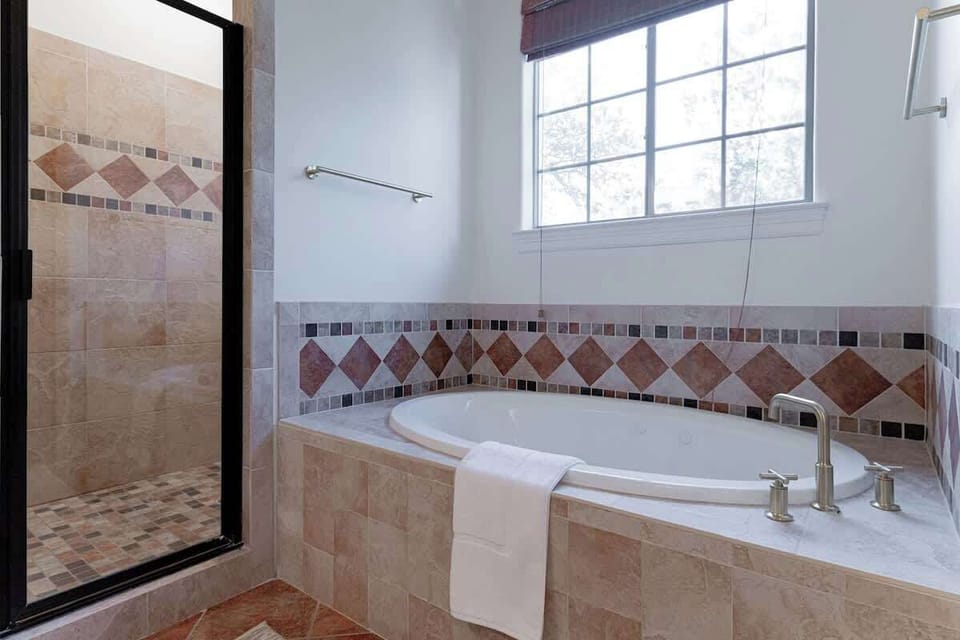 There is a walk-in shower and soaking tub in Bathroom 1