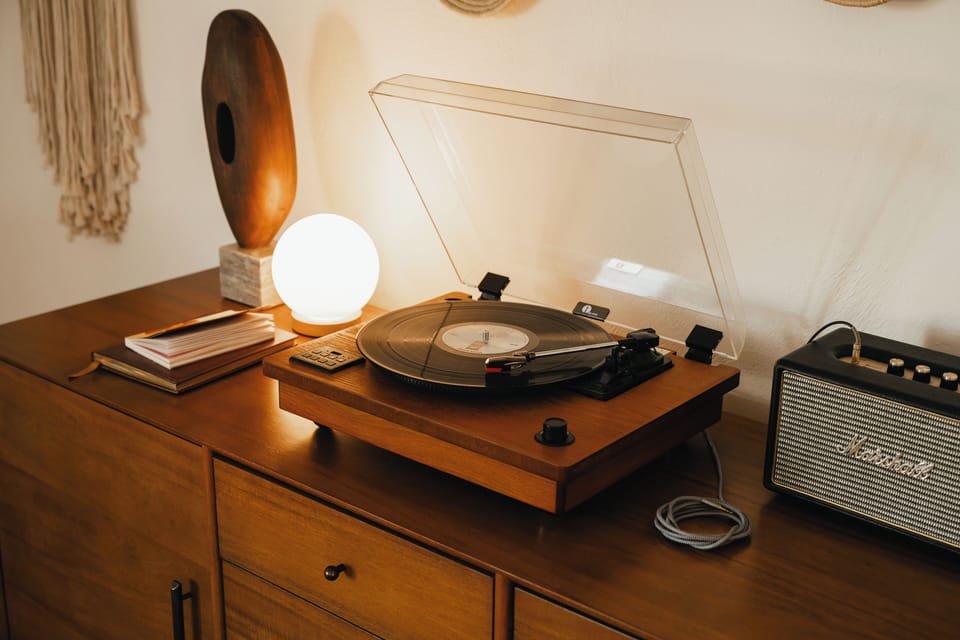 Sign our guestbook while listening to a record on the record player