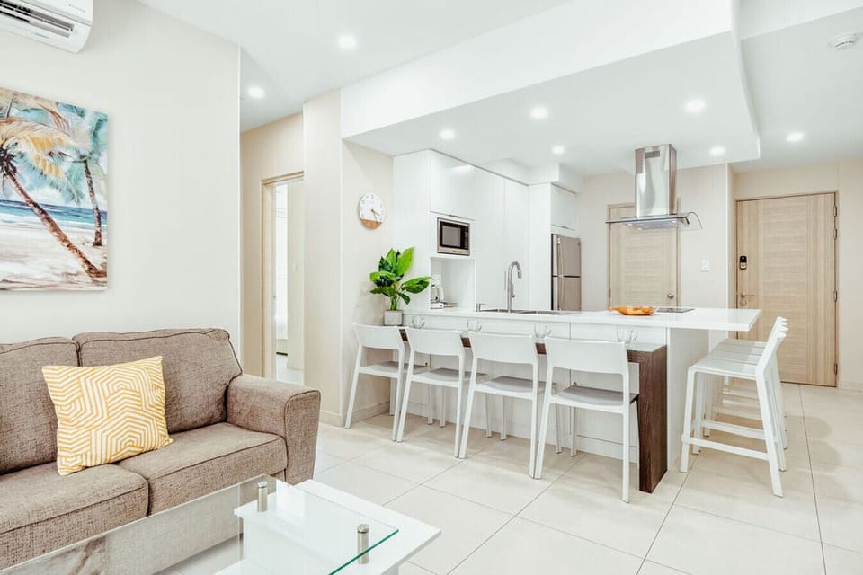 An open, airy space with a comfy lounge and full kitchen—easy to relax, cook, and spend time together.