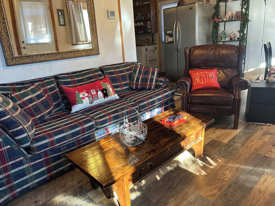 Living room- large couch, leather recliner.