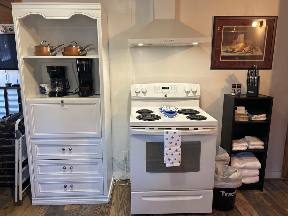Guest House Kitchen (c) 
microwave in the hutch under coffee pots 