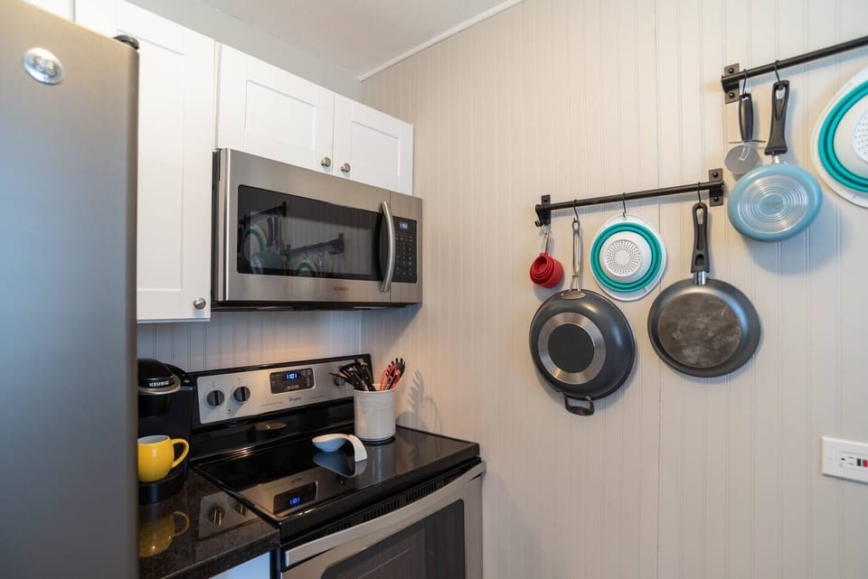 2 Coffee Makers. K-Cup and Standard,  Microwave - Pots and pans have been put in cabinets to keep sanitary