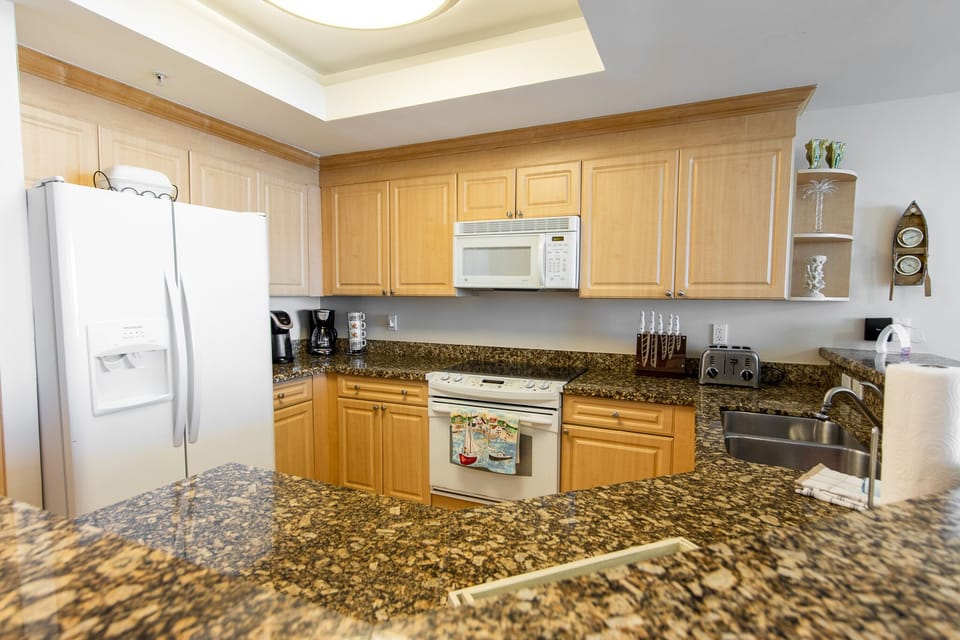 Fully stocked kitchen with keurig coffee machine.