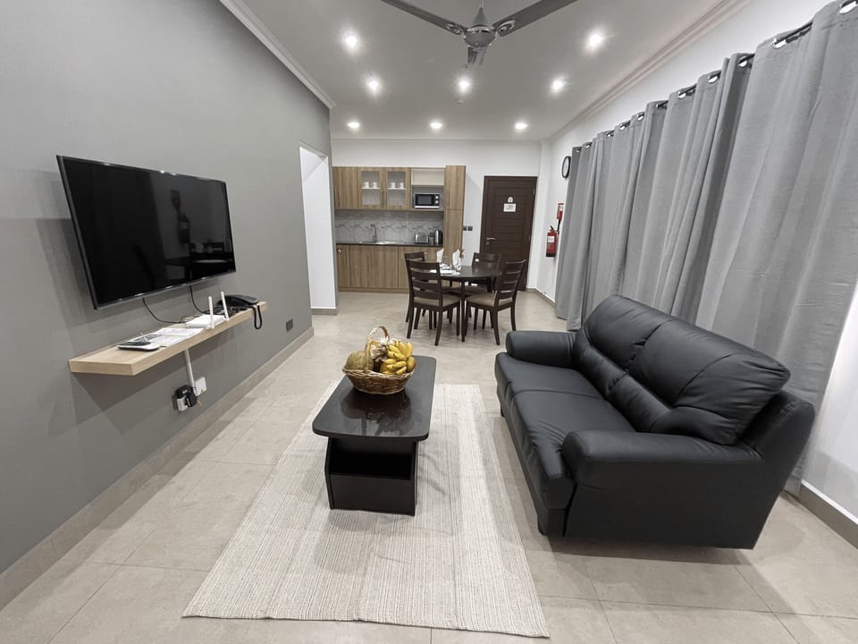 Standard Apartment | Living area | 110-cm LED TV with cable channels, TV