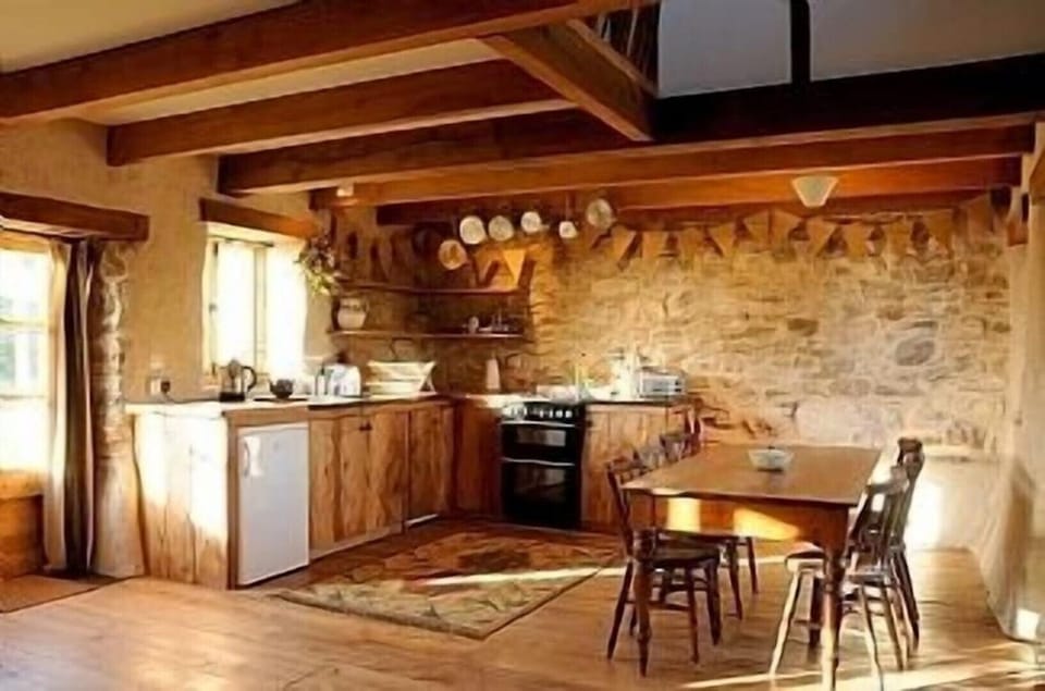 Kitchen and dining area. Table seats 10.
There is an additional large fridge .