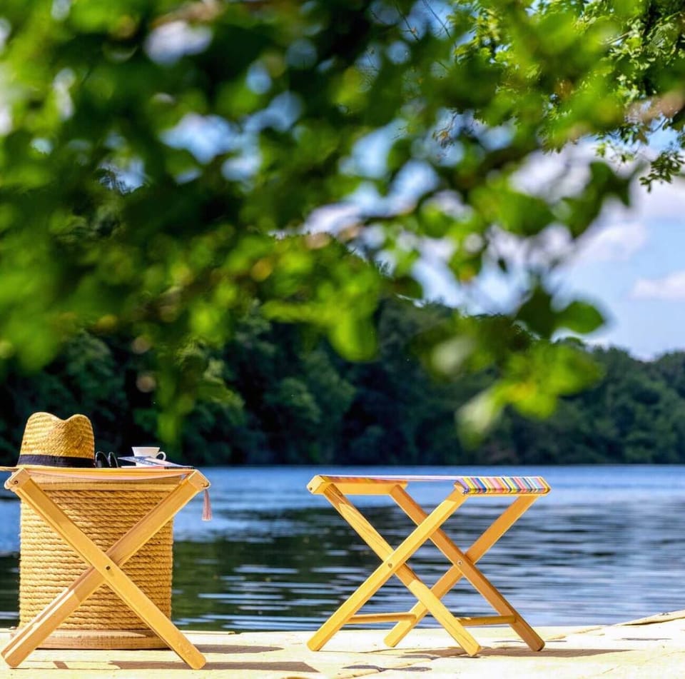 Holiday home with private pontoon on the water's edge, perfect for relaxing with your feet in the water