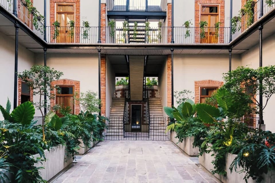 Enjoy lazy mornings with our charming French cafe in the building's main "patio", surrounded by beautiful and vibrant gardens that elevate your mood and enhance your stay.