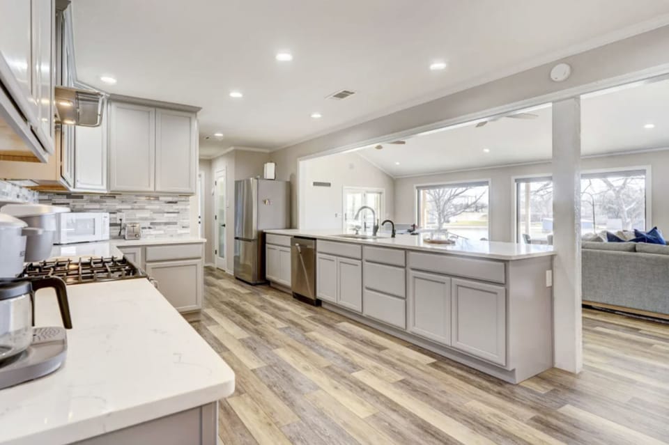 Open concept kitchen with large island peninsula 