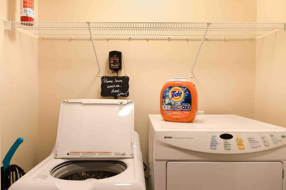 Washer and Dryer room in the hallway by the bedrooms for your use