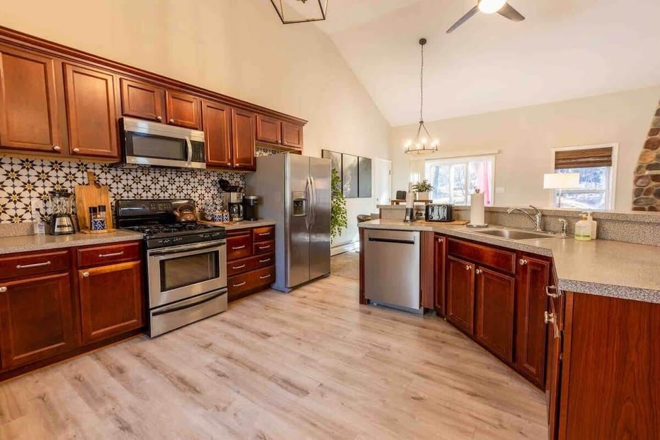 Spacious Fully Equipped Kitchen with Stainless Appliances