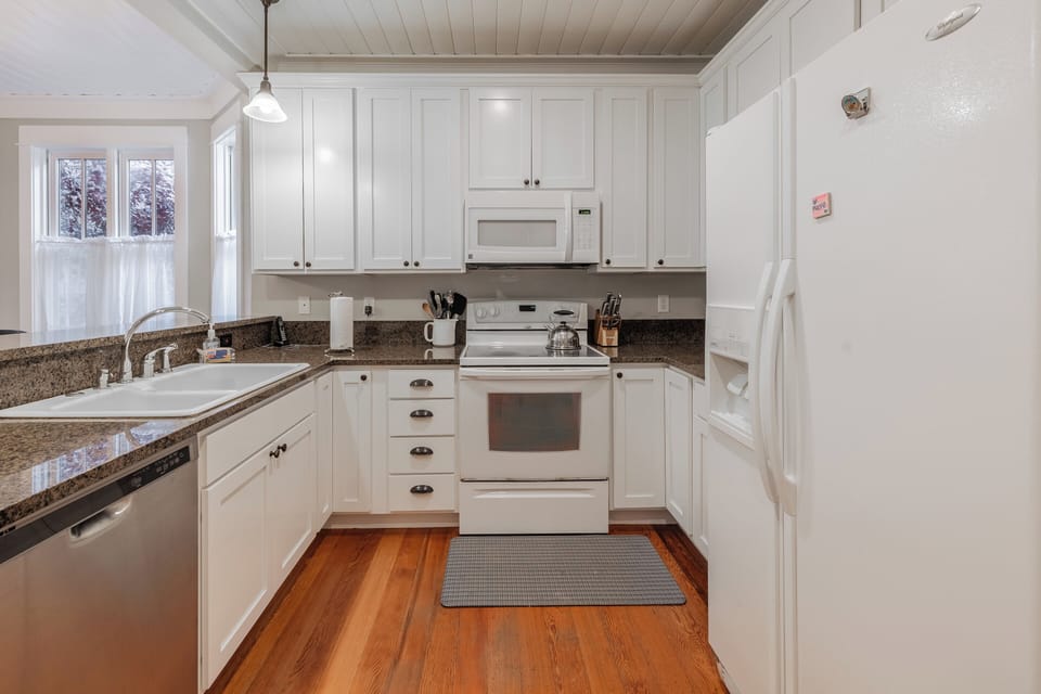 The fully equipped kitchen is ready for your culinary creations