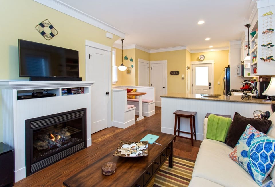Living room with gas fireplace and tv