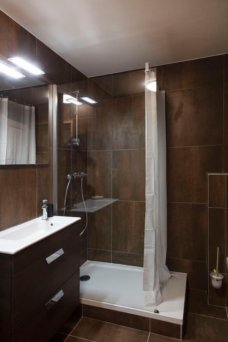 Freshen up in our sleek bathroom.