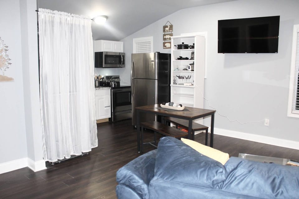 Living room has a large screen TV for the nights you want to stay in and relax.