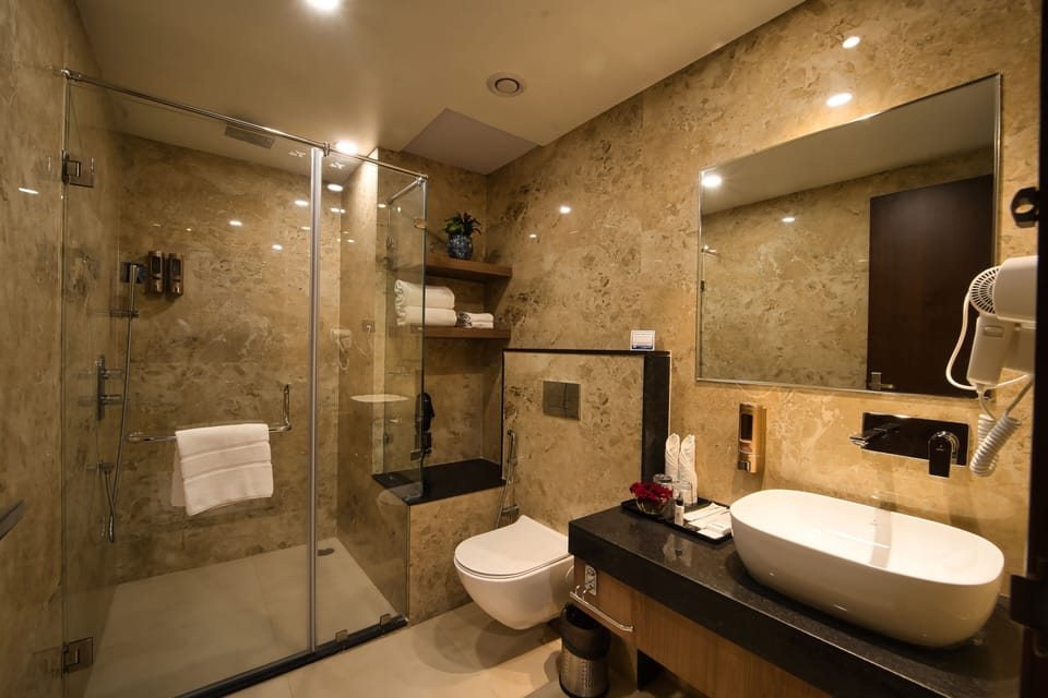 Shower, rainfall showerhead, designer toiletries, hair dryer