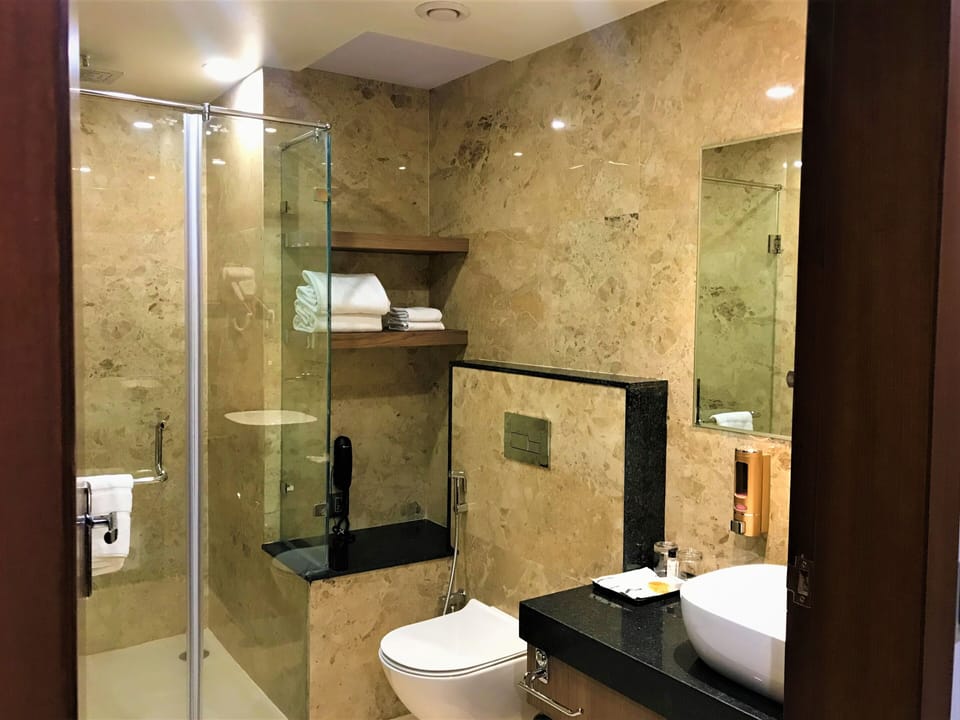 Shower, rainfall showerhead, designer toiletries, hair dryer
