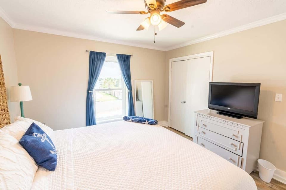 Bedroom with Closet, TV, and dresser