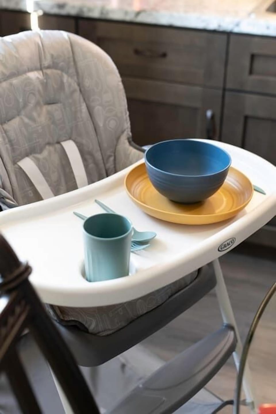 High chair with 4 sets of children dinnerware. 