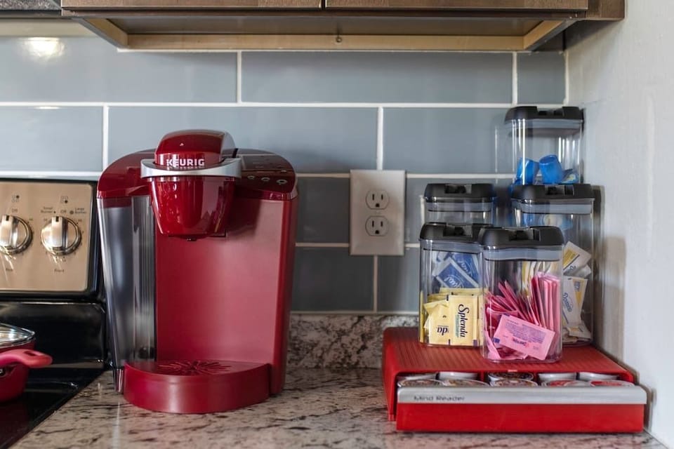 Keurig with free coffee, cream sugar and sugar substitutes. 