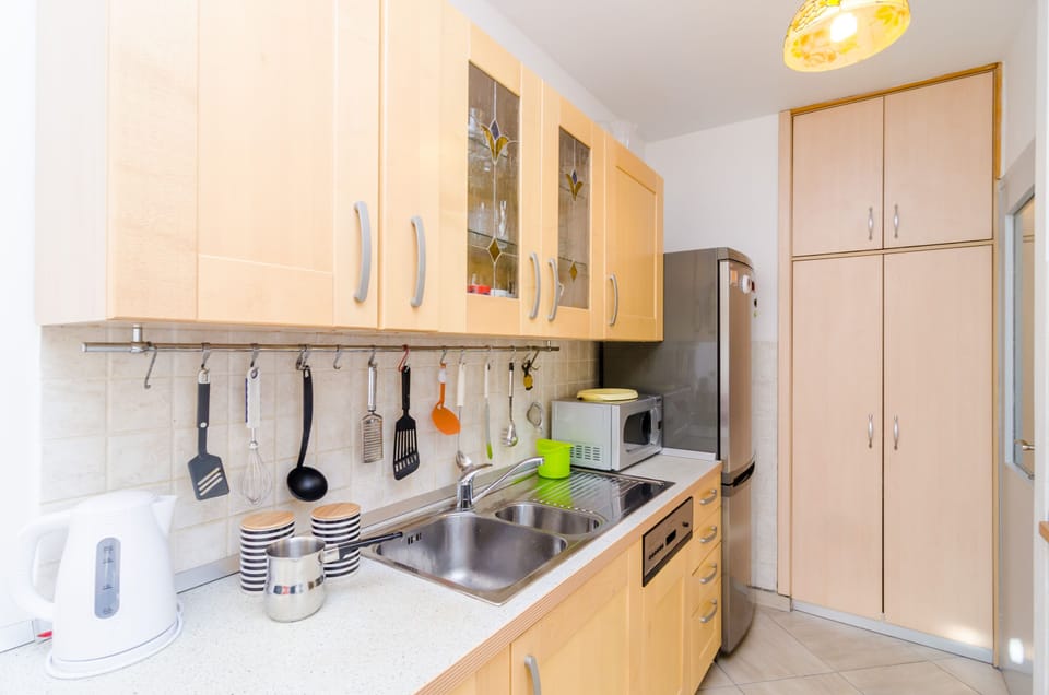 Apartment, Sea View | Private kitchen | Fridge, microwave, oven, stovetop