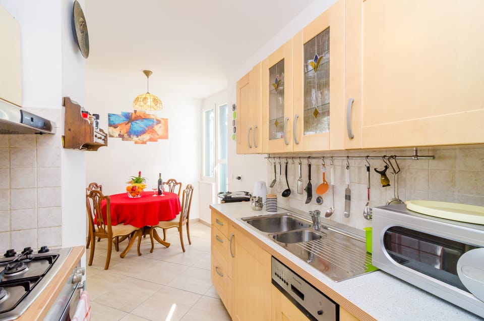 Apartment, Sea View | Private kitchen | Fridge, microwave, oven, stovetop