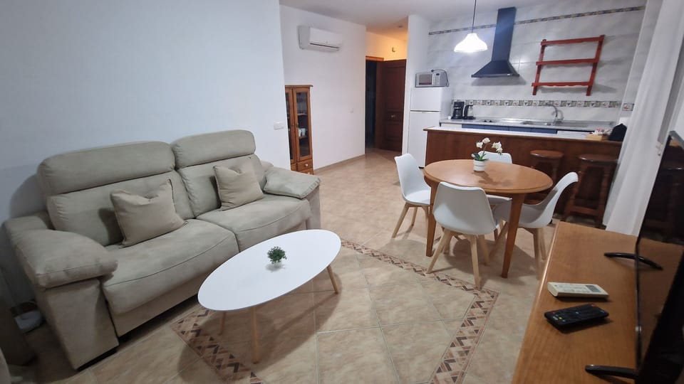Superior Apartment, Partial Sea View | Living area | 32-inch Smart TV with cable channels, TV