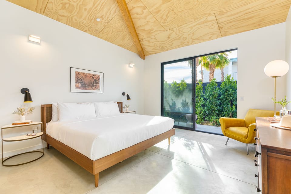 Your room features a king bed, ensuite bathroom, TV, and patio.