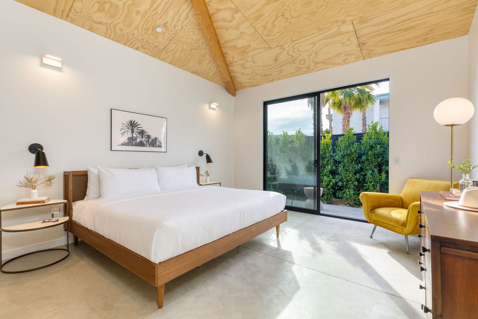 Unit B2 features a king bed, private patio, and ensuite bathroom.
