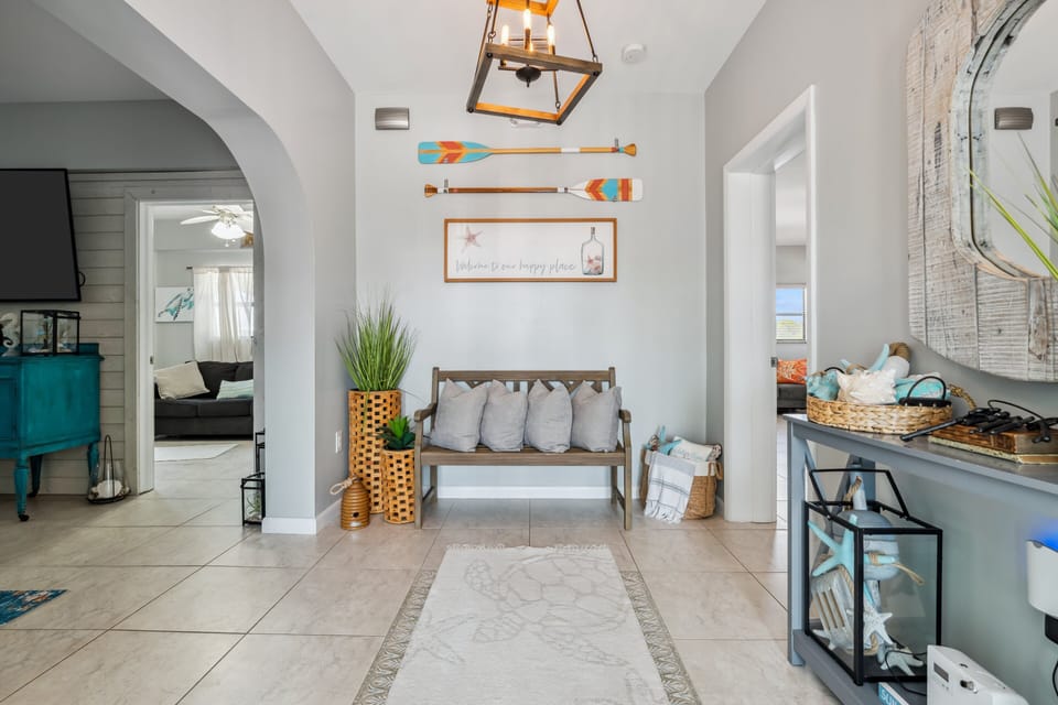 Wide entry corridor offering convenient access to bedrooms, bathrooms, and gathering spaces.