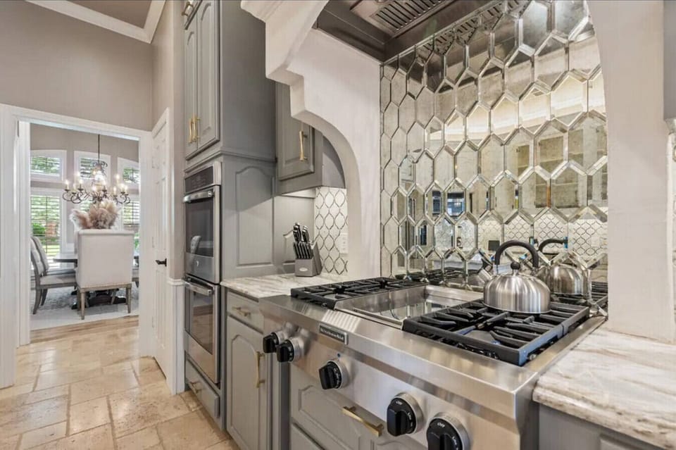 Gas stove top with vent, griddle and dual ovens