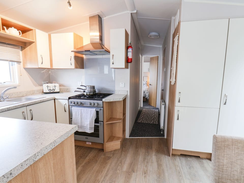 Fridge, electric kettle, toaster, cookware/dishes/utensils