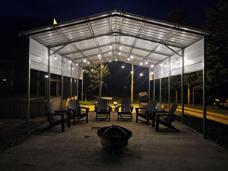 Covered Patio with Fire Pit, Adirondack Chairs, Picnic Table, Grill & Firewood
