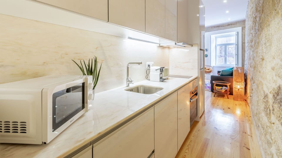 Kitchen includes electric kettle, coffee machine, toaster, stove top and microwave, as well as all the essential kitchenware and supplies #kitchen #lovelystay