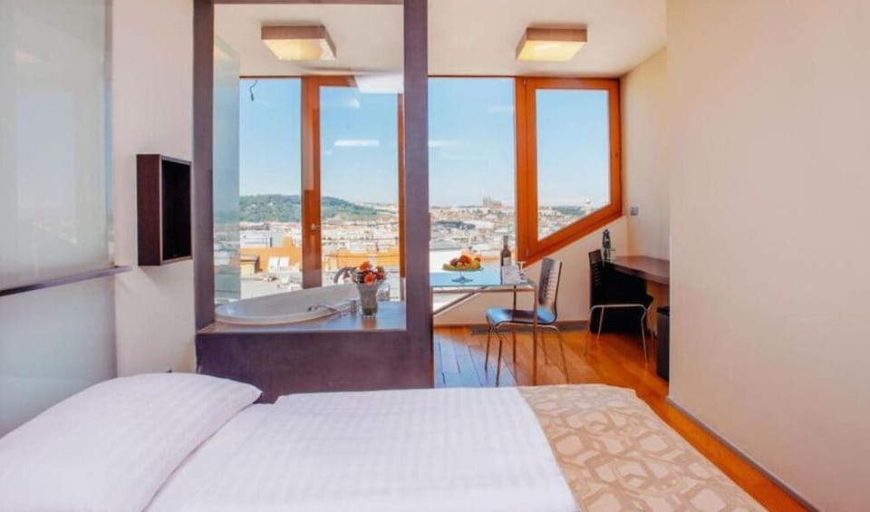 Deluxe Double Room Castle view | Minibar, in-room safe, desk, laptop workspace