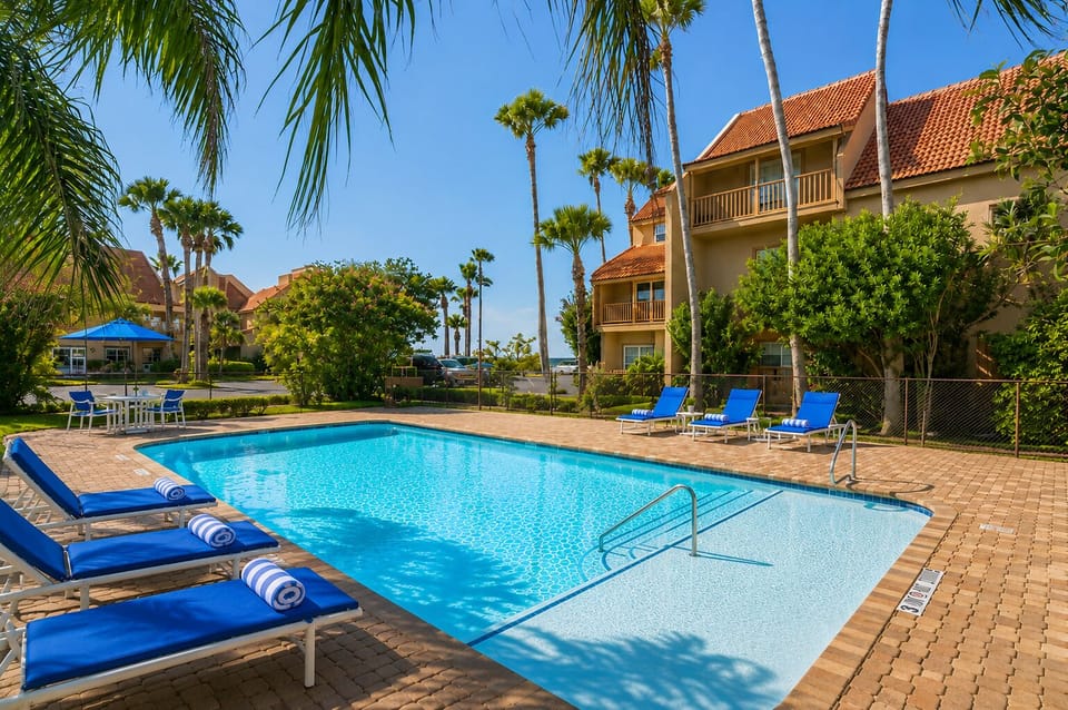 Crystal clear pool under the palms