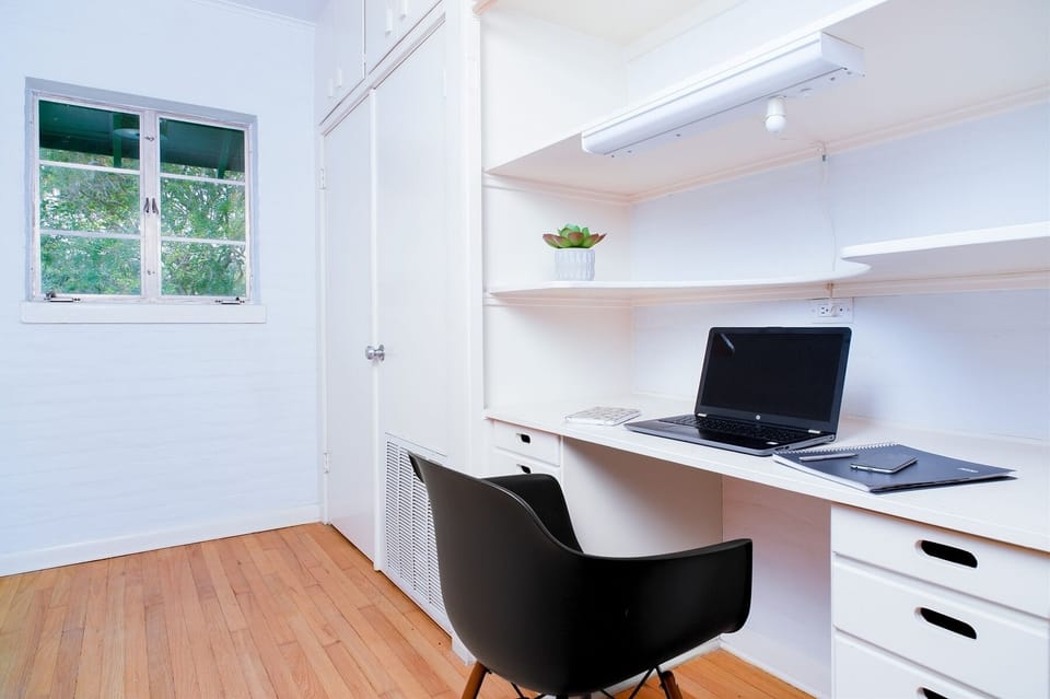 Second floor living loft with full bath dedicated workspace to queen beds living space streaming TV