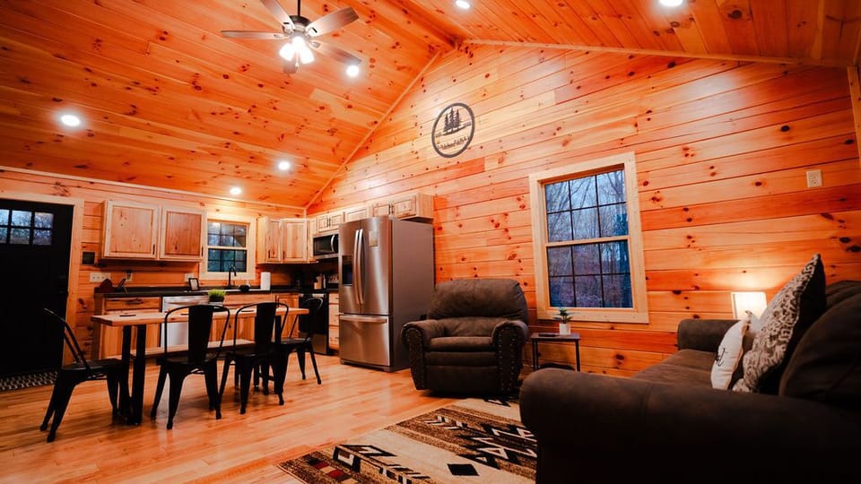 Open floor plan in the kitchen/living space with vaulted ceiling.