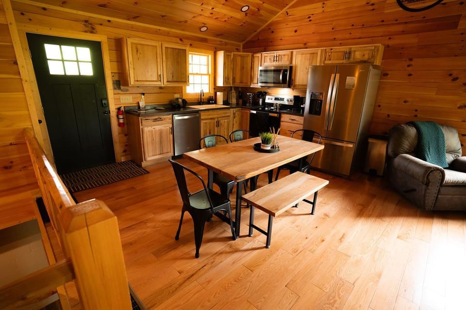Open floor plan in the kitchen/living space with vaulted ceiling.