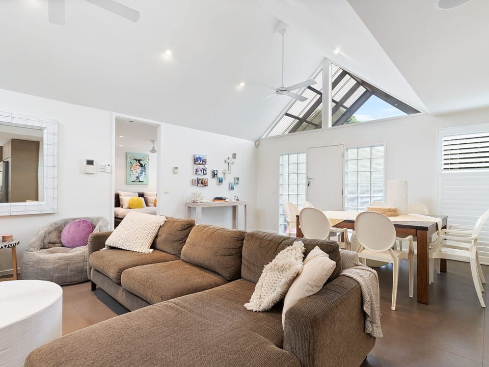 A skylight illuminates the happiness that fills this inviting living room